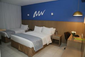 Cama ou camas em um quarto em Real Classic Bahia Hotel