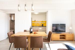a kitchen and dining room with a wooden table and chairs at Seaview Vela Luka in Vela Luka