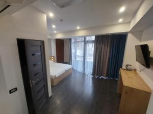 Voodi või voodid majutusasutuse Friendly Hotel toas