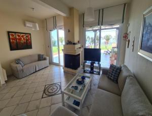 Χώρος καθιστικού στο Stunning beachfront villa for rent