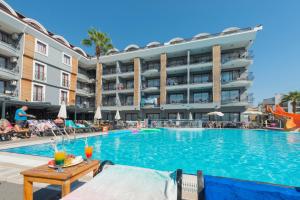 a swimming pool in front of a hotel at Club Viva Hotel in Marmaris