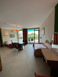 A bed or beds in a room at Briz Beach apartments - section B