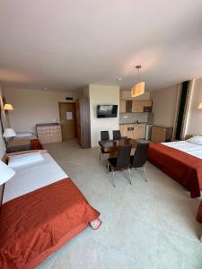 A bed or beds in a room at Briz Beach apartments - section B