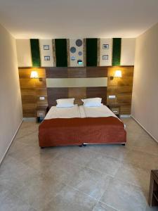A bed or beds in a room at Briz Beach apartments - section B