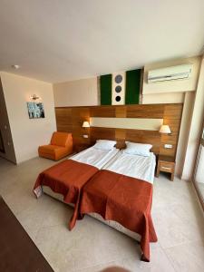 A bed or beds in a room at Briz Beach apartments - section B