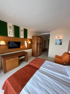 A bed or beds in a room at Briz Beach apartments - section B