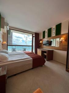 A bed or beds in a room at Briz Beach apartments - section B