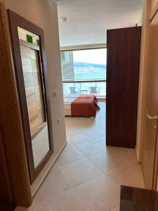 A bed or beds in a room at Briz Beach apartments - section B