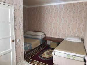 Voodi või voodid majutusasutuse RAHAT Guest House & Hostel in Toktogul toas
