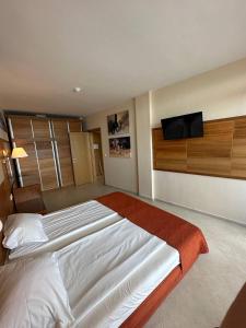 A bed or beds in a room at Briz Beach apartments - section B