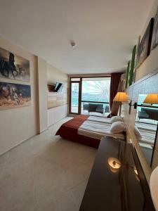 A bed or beds in a room at Briz Beach apartments - section B