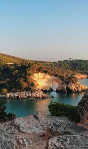 a view of a river with a bridge at Dimora Il Tulipano in Vieste +10 photos