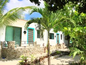Zahrada ubytování CAMP AKUMAL - Hosted Family Bungalows