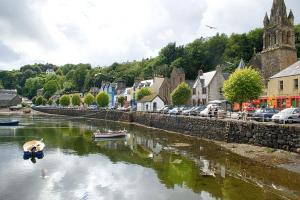 a river with boats in the water in a town at Tobermory Youth Hostel in Tobermory