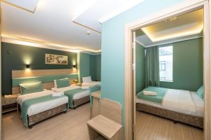 Postel nebo postele na pokoji v ubytování The Hotel Ottoman City Istanbul
