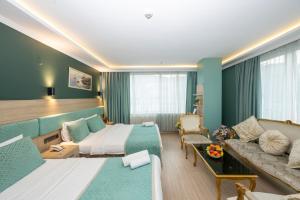 Postel nebo postele na pokoji v ubytování The Hotel Ottoman City Istanbul