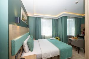 Postel nebo postele na pokoji v ubytování The Hotel Ottoman City Istanbul