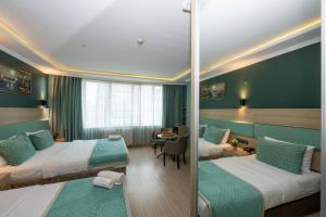 Postel nebo postele na pokoji v ubytování The Hotel Ottoman City Istanbul