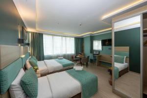 Postel nebo postele na pokoji v ubytování The Hotel Ottoman City Istanbul