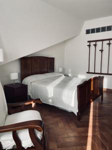 En eller flere senger på et rom på Villa Cipriano