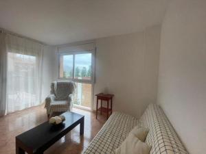 a living room with a couch and a table at Reconnectar Malgrat de Mar Colom I in Malgrat de Mar +13 photos