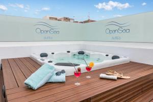 a jacuzzi tub on the deck of a yacht at Open Sea Suites in Las Palmas de Gran Canaria