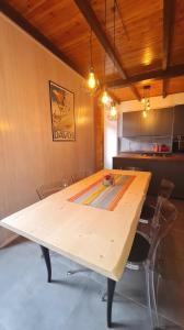 a large wooden table in a room with chairs at Casa Claudia Pieve centro storico in Tremosine Sul Garda