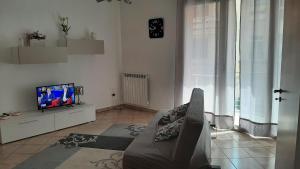 a living room with a couch and a tv at ORO BIANCO in Marsala