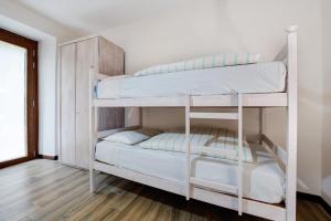 Postel nebo postele na pokoji v ubytování Cascina Nonna Nina