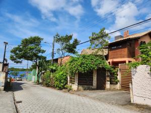 an empty street with a building on the side at Floripa Guest House in Florianópolis