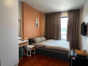 Ένα ή περισσότερα κρεβάτια σε δωμάτιο στο Smile Residence at Kaset-Sena