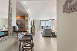 a living room with a kitchen and a dining room at Perdido Towers East 403 in Perdido Key