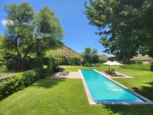 a swimming pool in the middle of a yard at Big Sky Ranch in Colesberg