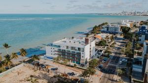 an aerial view of the beach and the ocean at Apartamentos Pe na areia no Caribessa in Tambaú