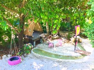 Zahrada ubytování CAMP AKUMAL - Hosted Family Bungalows