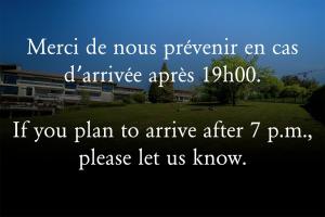 a sign that readsmetre de nowrepentant an as airplane at Centre Jean XXIII in Annecy