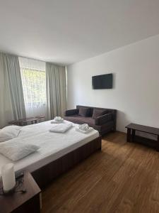 Ένα ή περισσότερα κρεβάτια σε δωμάτιο στο Paradox Oituz