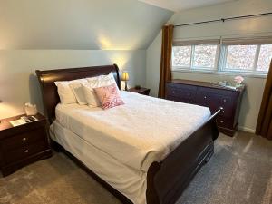 a bedroom with a large bed and a window at The Manse in Whitefish