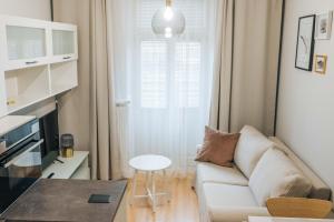 TV a/nebo společenská místnost v ubytování Apartamenty Optimal