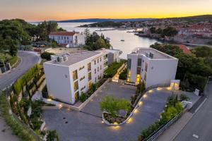 an aerial view of a building and a river at HADRIE LUXURY RESORT AND VILLAS Krk in Krk