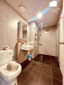 a bathroom with a shower and a toilet and a sink at Maison life 小居屋 Jesselton Quay CityPads in Kota Kinabalu