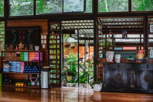 a room with a large window and a counter at Selva Madre Eco-Sanctuary in Cahuita