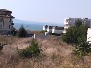 a view of a city with buildings and the ocean at Апартамент Тита in Burgas