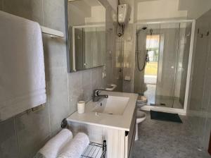 a bathroom with a sink and a toilet at Case Vacanza Calabria Ionica in Cropani