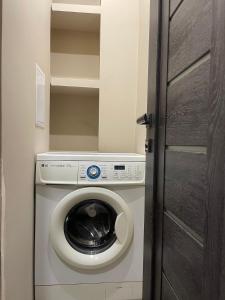 a washer and dryer in a small room at Avchieva's apartment on Orbeli Brothers Street in Yerevan