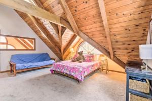 a bedroom with a bed and a teddy bear sitting on a table at Waitsfield Vacation Rental with Private Hot Tub in Waitsfield