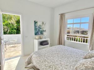 Posteľ alebo postele v izbe v ubytovaní Casa Boticaria, bonito Paraíso Privado con jardín y Jacuzzi.