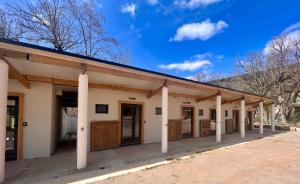 a row of stalls in a building at La Petite Auberge Insolite in Saint-Affrique