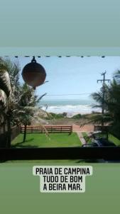 a sign that reads praia de cantina told to be born a beta man at casa de praia a beira mar in Campina