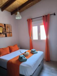 a bedroom with two beds with towels on them at Villa Daita 1 in Granadilla de Abona